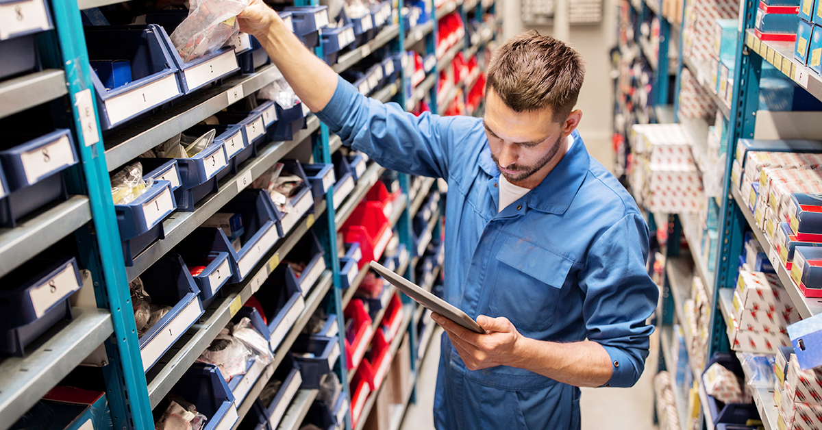 man shopping for B2B automotive parts using a tablet